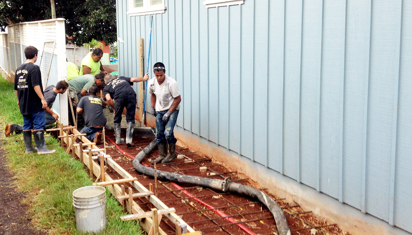 Photo: forms and rebar in place as crew prepares to pump concrete for walkway