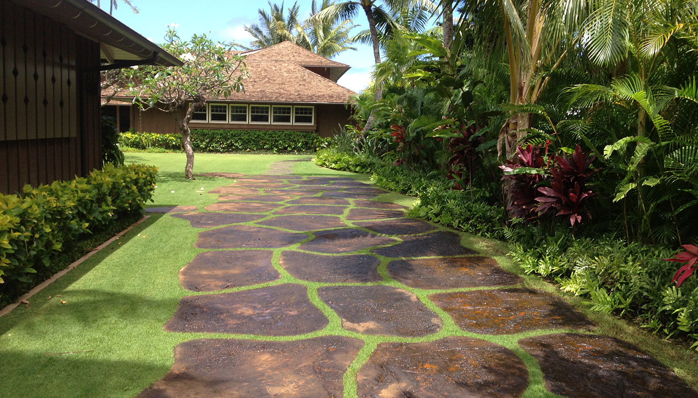 Photo: custom concrete flatwork for island-style driveways and walk ways.