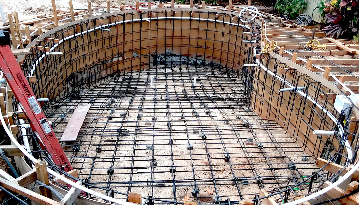 Slideshow: building a kidney-shaped residential swimming pool, from start to finish.