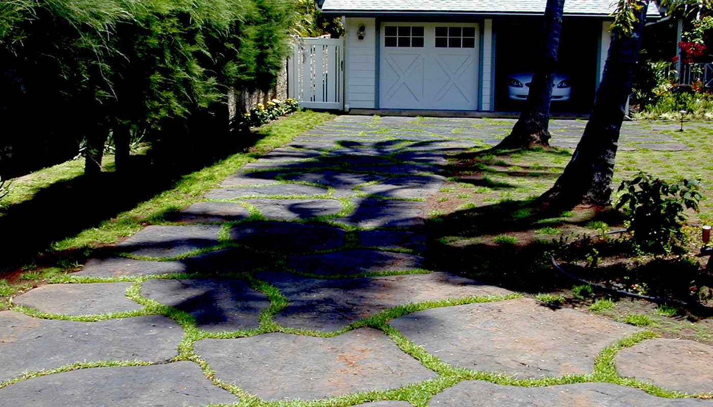 Photo: custom concrete driveway in landscaping