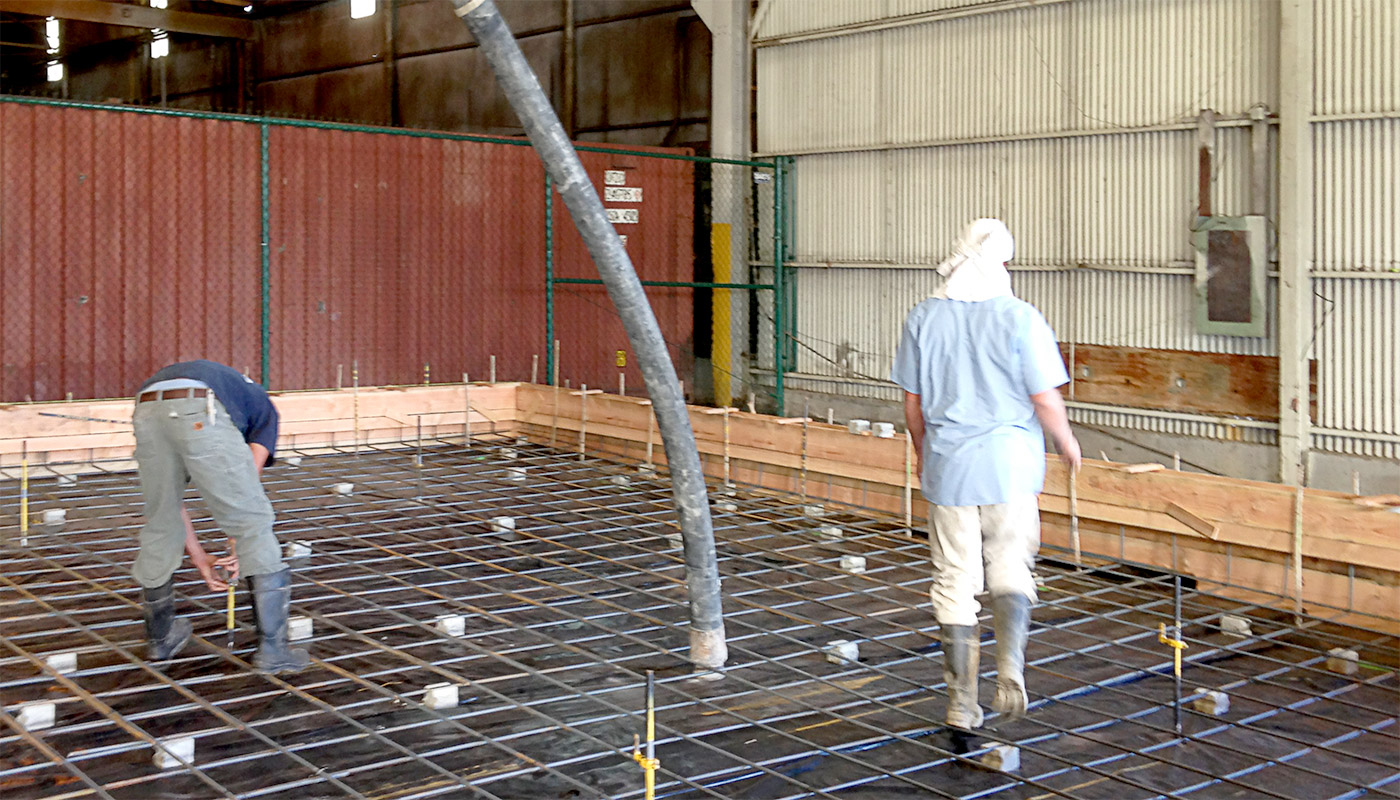 Photo: pumping concrete for industrial cement floor for Chinatown fish market (Honolulu, Oahu, Hawaii)