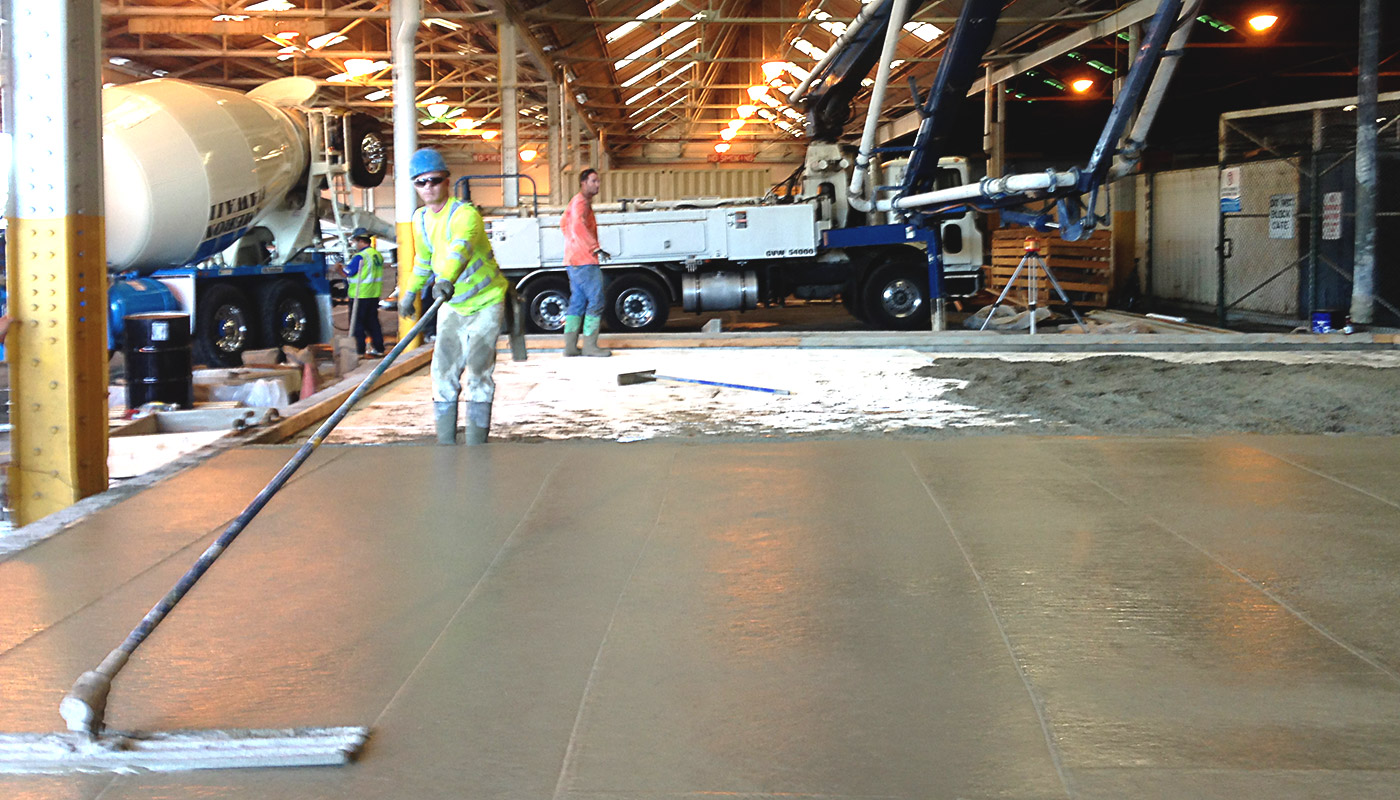 Photo: floating the industrial cement floor for Chinatown fish market (Honolulu, Oahu, Hawaii)