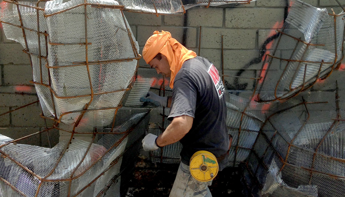 Slideshow: building a custom water feature, shotcrete boulders and waterfall.