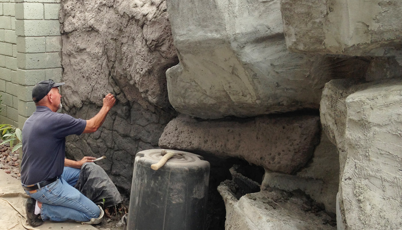 Slideshow: building a custom water feature, shotcrete boulders and waterfall.