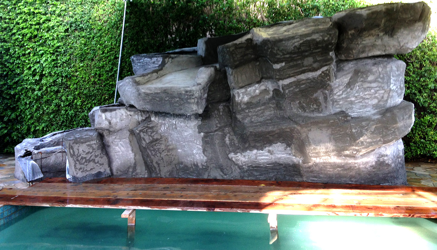 Photo: swimming pool retrofit, add waterfall feature