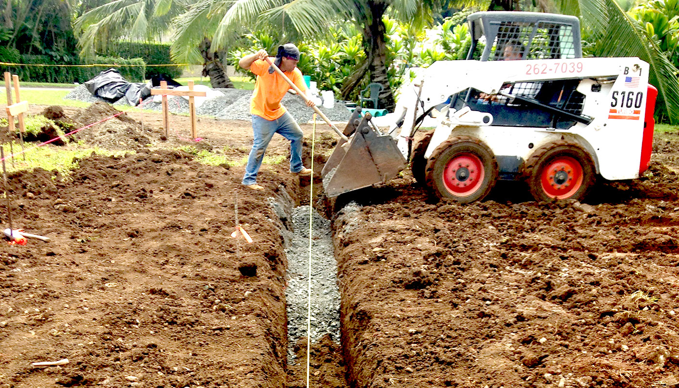 Photo: concrete slab foundation and flatwork for Haiku residence.