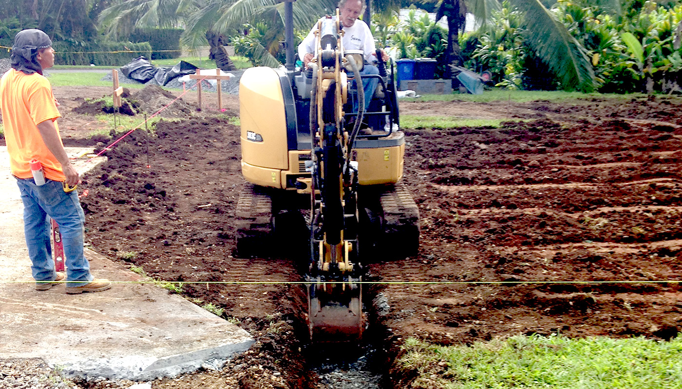 Photo: concrete slab foundation and flatwork for Haiku residence.