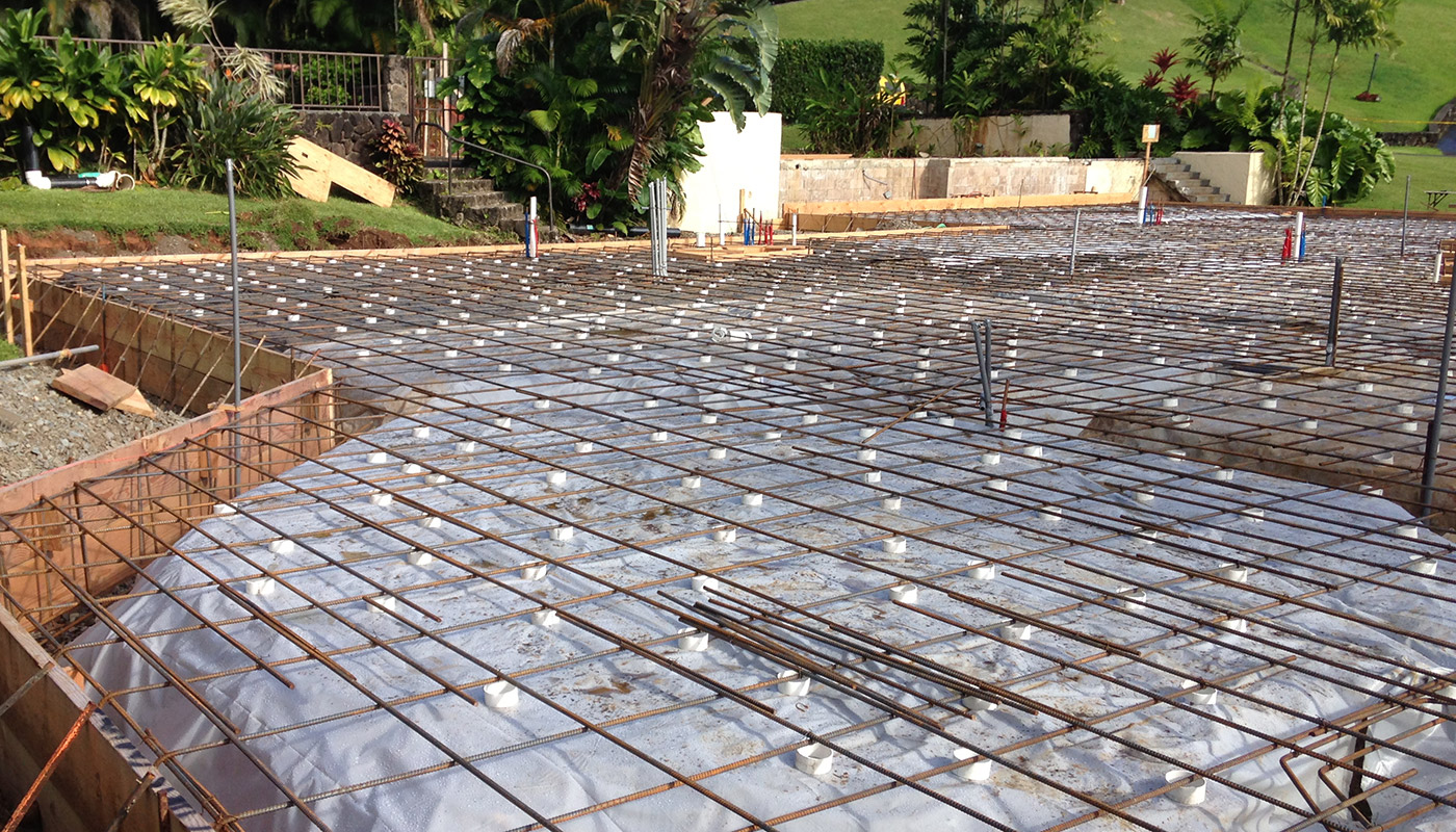 Photo: concrete slab foundation and flatwork for Haiku residence.