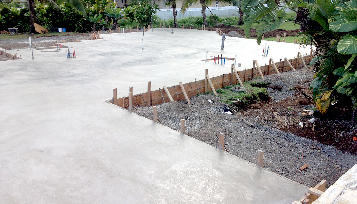 Photo: concrete slab foundation and flatwork for Haiku residence.